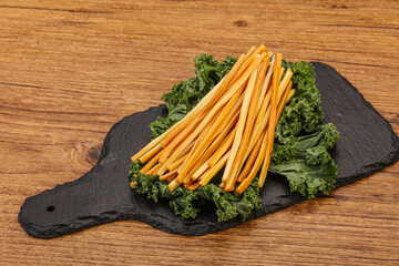 Chechel cheese sticks over board