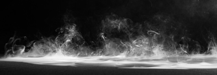 Abstract smoke on a dark background .
