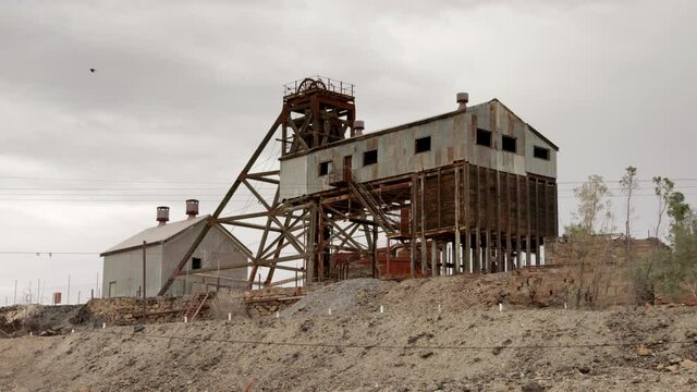 headframe and buildings of the historic junction mine at broken hill in western nsw, australia