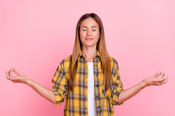 Photo of adorable positive lady closed eyes arms meditate wear checkered isolated on pink color background