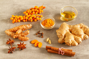 Ingredients for healthy lifestyle Ground turmeric, curcuma root, cinnamon, ginger, honey, cardamom, anise and seabuckthorn
