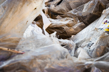 Cellophane packaging waste background. Problems of waste disposal and ecology of the materials used. Recycling and reuse of cellophane.