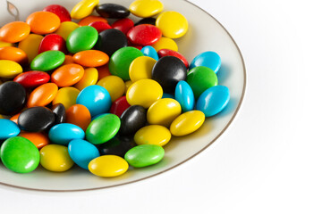 Rainbow-colored candies, multicolored close-up, texture, background.