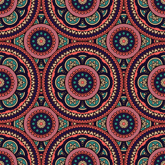 Abstract seamless backdrop. Round colorful texture in red, violet and blue colors. Mandala background. Oriental pattern for design