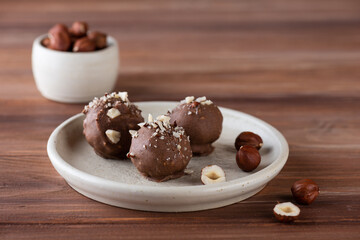 Homemade truffles with chocolate covered hazelnuts. Sugar, gluten and lactose free and vegan.