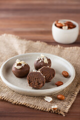 Homemade truffles with peanuts in chocolate. Sugar, gluten and lactose free and vegan.