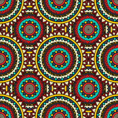 Abstract seamless backdrop. Round colorful texture in red, yellow and blue colors. Mandala background. Oriental pattern for design