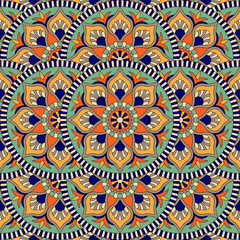 Abstract seamless mandala background. Texture in blue and yellow colors. Oriental pattern for design, fashion print, scrapbooking