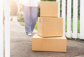 A woman go to the parcel box