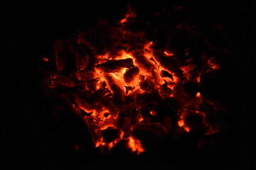 Fototapeta na wymiar The embers of burning wood, wood burning in the fireplace.