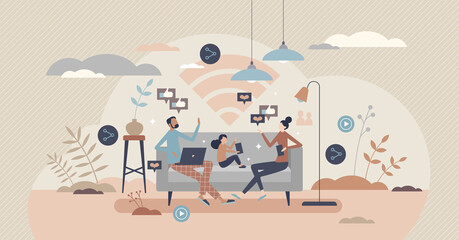 Family using internet at home while sitting on couch, tiny person concept. Spending time online together indoors. Mother, father and kid with mobile gadgets. Wireless connection and modern life tech.