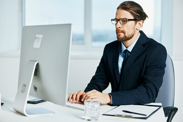 male manager at the desk with glasses work executive