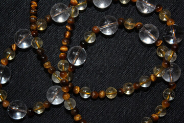 Beads made of natural stones (citrine, rhinestone and tiger's eye).