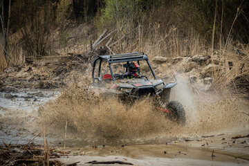 ATV/UTV/4x4 driving in muddy water