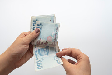 Hand of woman counting Turkish lira banknotes.economy concept selective focus.