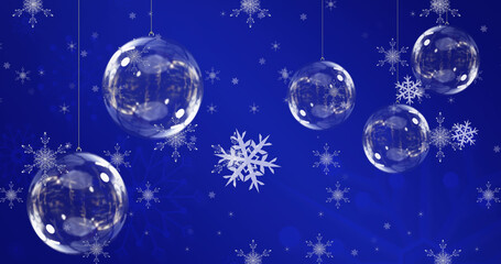 Fototapeta na wymiar Image of christmas balls over snowflakes on blue background