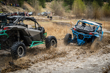 Atv vehicles in muddy water at the quad (buggy) competition © Antonio