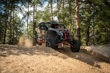 UTV, ATV off road driving in sandy open area. Buggy extreme riding