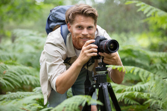professional nature photographer using a tripod