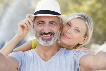 loving mature couple taking selfie