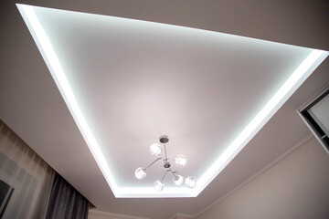 A beautiful stretch ceiling with diode lighting and an unusual chandelier with balls. Designer...