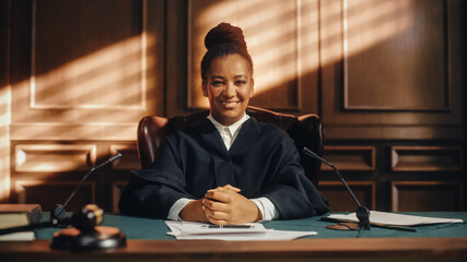 Cinematic Court of Law Trial: Portrait of Impartial Smiling Female Judge Looking at Camera. Wise,...