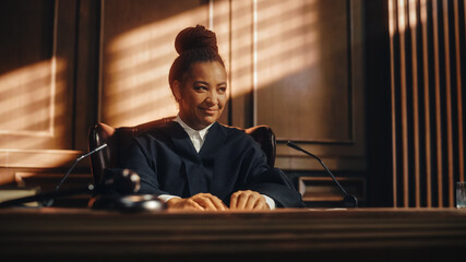 Cinematic Court of Law Trial: Humane Portrait of Impartial Smiling Female Judge Listening Happily...