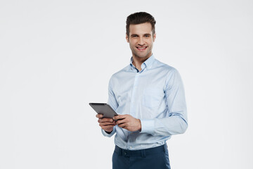 Smiling european business man hold digital tablet
