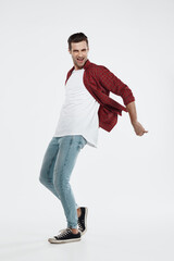 Young happy european man enjoying and dancing