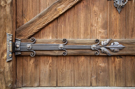 Beautiful Handmade Forged Door Hinge, Close-up. Ancient Architecture, Gothic