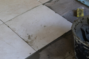 Close-up Installing tiles floor in construction work