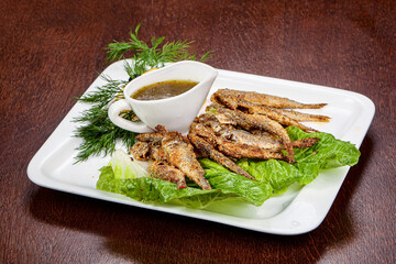 Fried barabulka fish with sauce