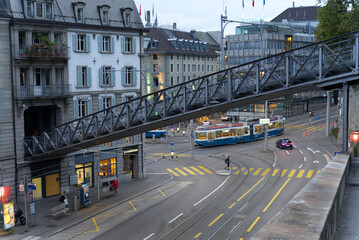 Central square at late summer evening with trams, cars, pedestrians and street lights. Photo taken September 17th, 2021, Zurich, Switzerland.