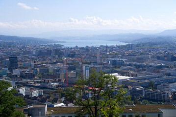 Obraz premium Panorama view over the City of Zurich with lake Zurich and Swiss alps in the background at a beautiful late summer day. Photo taken September 18th, 2021, Zurich, Switzerland.