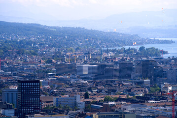 Panorama view over the City of Zurich with lake Zurich and Swiss alps in the background at a beautiful late summer day. Photo taken September 18th, 2021, Zurich, Switzerland.