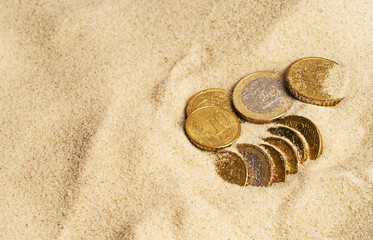 Fototapeta na wymiar Lost coins in the sand, treasure chest concept