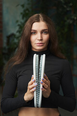 beautiful young woman holding closed set of sadhu boards
