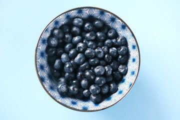Close up of fresh blue berry with water drops .