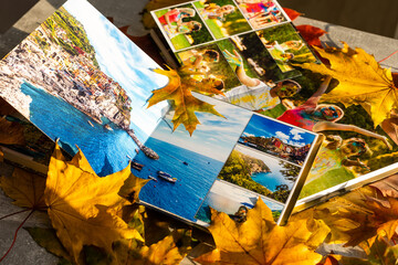 Photobook on the leaves background, closeup of photobook, family photo album