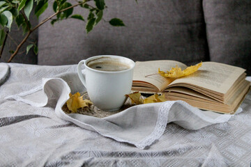 a cup of black coffee and a book