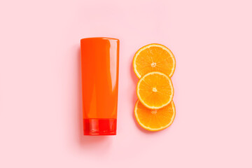 Mockup of unbranded orange shampoo or conditioner bottle for branding and label and three sliced...