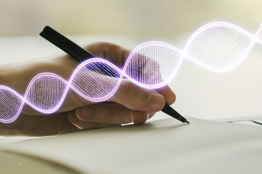 Double exposure of creative DNA hologram and man hand writing in notebook on background. Bio Engineering and DNA Research concept