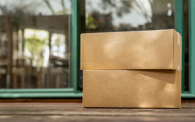 cardboard boxes delivered to the forn door and left outside for contactless pickup, delivery for online shopping, contact-free delivery and pickup due to COVID-19. High quality photo
