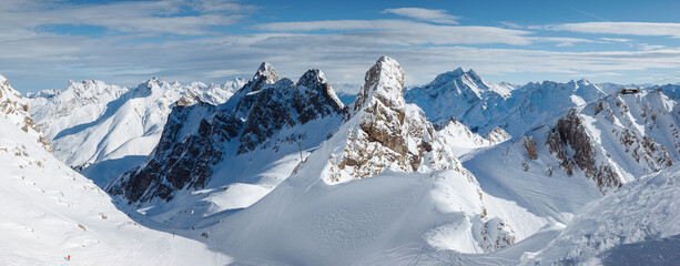 Picturesque view over steep slopes on skiing area on a frosty day.