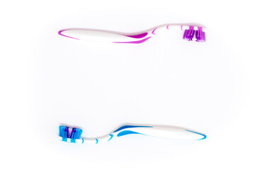 Toothbrushes on a white background. Oral hygiene. Male and female couple, family hygiene and relationships.