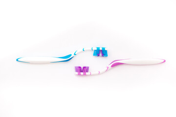 Toothbrushes on a white background. Oral hygiene. Male and female couple, family hygiene and relationships.