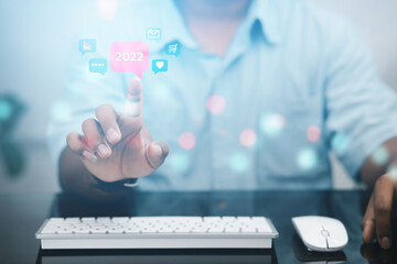 Business man analyzing investments in 2022, targeting online business planning via laptop in information technology investments.
