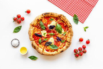 Homemade italian pizza margherita with tomatoes cheese and basil, top view