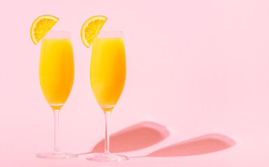 Refreshing orange Mimosa cocktails with champagne.