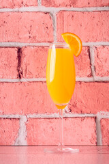 Refreshing orange Mimosa cocktails with champagne.